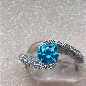 Simulated blue gemstone ring.